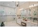 Spa-like Primary bathroom with double vanity, large walk-in shower, and plenty of mirrors at 9044 Luna Ln, Sarasota, FL 34241