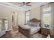 Spacious Primary bedroom with king-size bed and access to the bathroom and hallway at 9044 Luna Ln, Sarasota, FL 34241