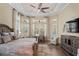 Large Primary bedroom with a king-size bed, sitting area, and plenty of natural light at 9044 Luna Ln, Sarasota, FL 34241