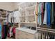 Large walk-in closet with ample shelving and hanging space at 9044 Luna Ln, Sarasota, FL 34241