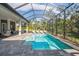 Inviting swimming pool with a spa and screened enclosure at 9044 Luna Ln, Sarasota, FL 34241