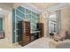 Elegant wine room boasts two large wine refrigerators and a comfortable seating area at 9044 Luna Ln, Sarasota, FL 34241