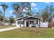 Updated home with modern black and white exterior and a landscaped yard at 1898 New Hampshire Ne Ave, St Petersburg, FL 33703