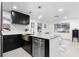 Modern kitchen with stainless steel appliances and a farmhouse sink at 1898 New Hampshire Ne Ave, St Petersburg, FL 33703