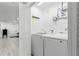 Convenient laundry room with side-by-side washer and dryer at 1898 New Hampshire Ne Ave, St Petersburg, FL 33703