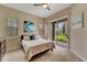 Bedroom with sliding glass doors leading to the backyard at 7 Barge Ln, Placida, FL 33946