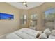 Bedroom with a queen bed, large TV, and window seating at 7 Barge Ln, Placida, FL 33946