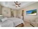 Bright bedroom featuring a king-size bed and ensuite access at 7 Barge Ln, Placida, FL 33946