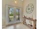 Bright entryway with double doors and a rustic console table at 7 Barge Ln, Placida, FL 33946