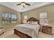 Main bedroom with king-size bed, window seating and large windows at 7 Barge Ln, Placida, FL 33946