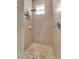 Walk-in shower with tiled walls and pebble floor at 7 Barge Ln, Placida, FL 33946