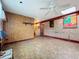 Large basement room with brick and wood paneling at 70 Horton Cir, Sarasota, FL 34232