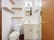 Simple bathroom with toilet and vanity at 70 Horton Cir, Sarasota, FL 34232