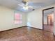 Bright bedroom featuring tile floors and a ceiling fan at 70 Horton Cir, Sarasota, FL 34232