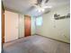 Bedroom with carpet, ceiling fan, and window at 70 Horton Cir, Sarasota, FL 34232