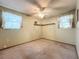 Bedroom with carpet, ceiling fan and windows at 70 Horton Cir, Sarasota, FL 34232