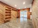 Dining room with wood-paneled accent wall and patio access at 70 Horton Cir, Sarasota, FL 34232