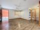 Bright living room featuring hardwood floors and a ceiling fan at 70 Horton Cir, Sarasota, FL 34232