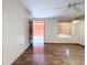 Living room with wood-look floors and exterior access at 70 Horton Cir, Sarasota, FL 34232