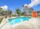 Relaxing pool area with spa and surrounding grassy yard at 70 Horton Cir, Sarasota, FL 34232