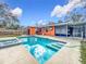 Inviting rectangular pool with spa and spacious patio at 70 Horton Cir, Sarasota, FL 34232