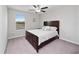 Cozy bedroom with a queen-size bed and neutral decor at 13327 Willow Bluestar Loop, Riverview, FL 33579