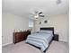 Bright bedroom featuring a double bed and dresser at 13327 Willow Bluestar Loop, Riverview, FL 33579