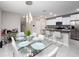 Kitchen dining area with a glass table and white chairs at 13327 Willow Bluestar Loop, Riverview, FL 33579