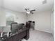 Bright home office features desk, laptop, and window at 13327 Willow Bluestar Loop, Riverview, FL 33579