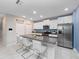 Modern kitchen with white cabinets and granite countertops at 13327 Willow Bluestar Loop, Riverview, FL 33579