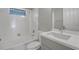 Clean bathroom with white tub and modern vanity at 2559 Comet Ln, North Port, FL 34286