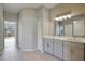 Modern bathroom with double vanity and tiled floor at 2559 Comet Ln, North Port, FL 34286