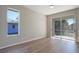 Bedroom with sliding glass doors and a window at 2559 Comet Ln, North Port, FL 34286