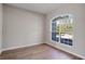 Bright bedroom with large window and wood-look flooring at 2559 Comet Ln, North Port, FL 34286