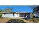 Rear view of the house showcasing a screened patio at 2559 Comet Ln, North Port, FL 34286