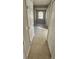 Light-filled hallway with tile flooring and access to other rooms at 2559 Comet Ln, North Port, FL 34286