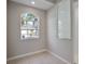 Bright laundry room with window and tile floor at 2559 Comet Ln, North Port, FL 34286