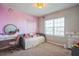 Bright bedroom with daybed, desk, and decorative wall at 4606 Pond Brook Ct, Bradenton, FL 34211