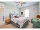 Cozy bedroom with a double bed, nightstand, and window at 4606 Pond Brook Ct, Bradenton, FL 34211