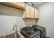 A practical laundry room with a sink, modern appliances, and ample storage space at 4606 Pond Brook Ct, Bradenton, FL 34211