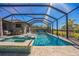 Relaxing pool and spa with screened enclosure and floating chairs at 4606 Pond Brook Ct, Bradenton, FL 34211