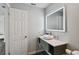 Stylish bathroom with a contemporary vanity and a large illuminated mirror at 1000 W Horatio St # 312, Tampa, FL 33606