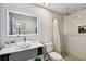 Updated bathroom with a modern vanity, a large mirror, and a walk-in shower at 1000 W Horatio St # 312, Tampa, FL 33606