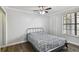 Bright bedroom featuring a ceiling fan, hardwood floors, and ample closet space at 1000 W Horatio St # 312, Tampa, FL 33606