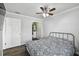 Comfortable bedroom with hardwood floors, a ceiling fan, and a walk-in closet at 1000 W Horatio St # 312, Tampa, FL 33606