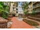 Inviting courtyard with brick walkways and lush landscaping at 1000 W Horatio St # 312, Tampa, FL 33606