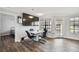 Bright dining area with large TV and hardwood floors at 1000 W Horatio St # 312, Tampa, FL 33606