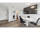 Modern dining area with a white table and four black chairs at 1000 W Horatio St # 312, Tampa, FL 33606