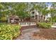 Community entrance with brick sign, landscaping and gated access at 1000 W Horatio St # 312, Tampa, FL 33606