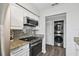 Updated kitchen with stainless steel appliances and granite countertops at 1000 W Horatio St # 312, Tampa, FL 33606